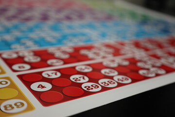 printing of colored and numbered game cards called bingo in the printing house. selective focus