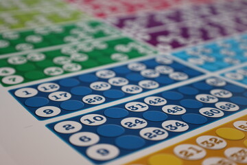 printing of colored and numbered game cards called bingo in the printing house. selective focus