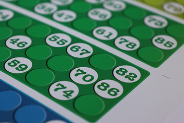 printing of colored and numbered game cards called bingo in the printing house. selective focus