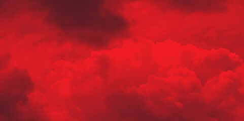 Black and red abstract background with a fiery red sky. Dramatic red sky. Red sunset with clouds. Fantastic sunset background with copy space for design.