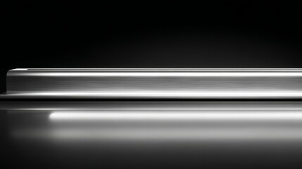 Sleek modern device on sleek black surface with reflective lighting effects.