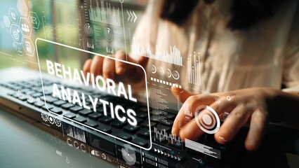 Hands Typing on Laptop with Overlay of Data Visualization and Behavioral Analytics Concept....