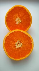 Juicy sliced oranges isolated on white