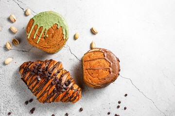 Various new york roll croissants and traditional french croissant with chocolate fillling.