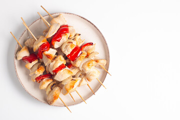Grilled chicken skewers. Satay with side lemon and salad. Kebab with sauces. 