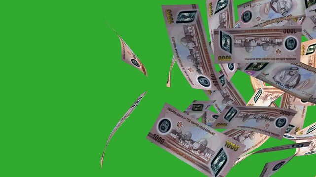 3D animation of New UAE dirham notes moving flying passing blown away from left to right on Green screen  background. Currency video transition effect overlay