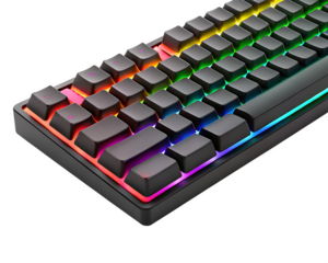 A close up shot of a black gaming keyboard with rainbow led backlight on a black background surface