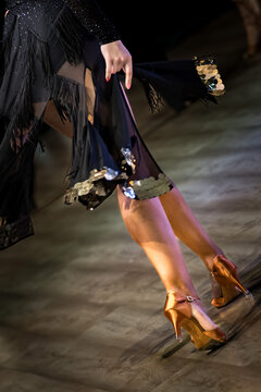 Legs of young dancers on the dance floor