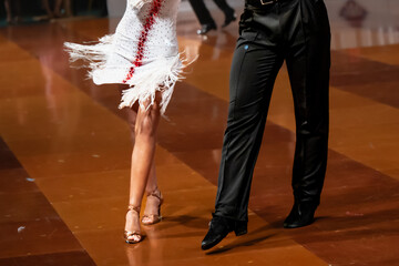 a couple dance a Latin dance. the legs of a dancing couple