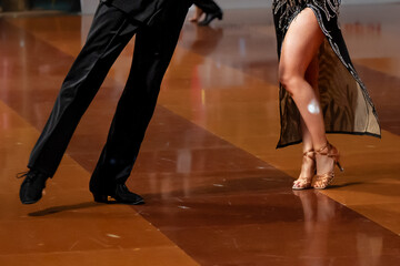 a couple dance a Latin dance. the legs of a dancing couple