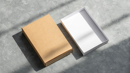 Open and closed cardboard boxes on a grey surface