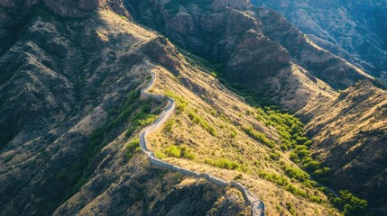 Isolated section of the Great Wall winding around a sharp mountain curve with dramatic landscape
