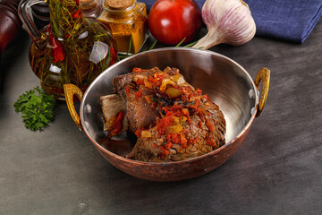 Baked beef ribs with vegetables