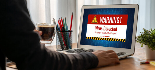 Virus warning alert on computer screen detected modish cyber threat , hacker, computer virus and...