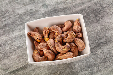 Unpeeled cashew nuts in the bowl