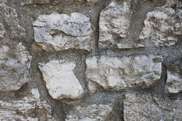 Close-up of rough stone wall texture
