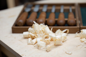 Wood shavings and carving tools
