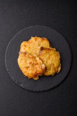 Steak, a pork or chicken chop covered with melted cheese. Grilled meat