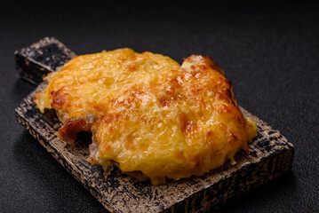 Steak, a pork or chicken chop covered with melted cheese. Grilled meat