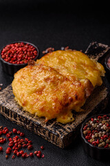 Steak, a pork or chicken chop covered with melted cheese. Grilled meat