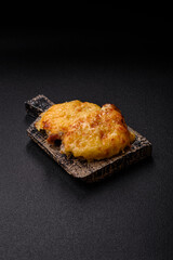 Steak, a pork or chicken chop covered with melted cheese. Grilled meat