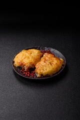 Steak, a pork or chicken chop covered with melted cheese. Grilled meat