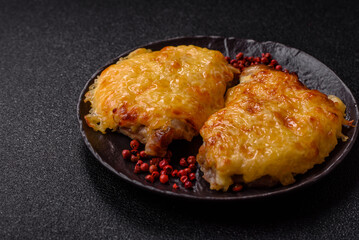 Steak, a pork or chicken chop covered with melted cheese. Grilled meat