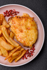 Fried French fries with a piece of meat, lunch food. Prepared potatoes and meat