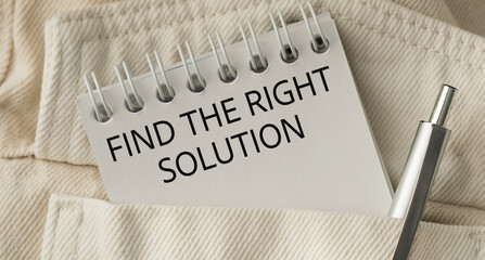 A pocket notebook with a pen and the words Find the Right Solution written on it.