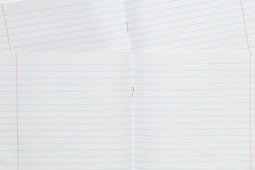 Two notebooks in a line, fastened with staples, educational background for school