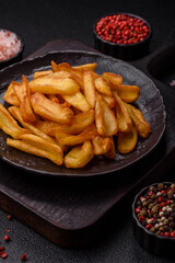 Fried crispy French fries with salt, spices, food for lunch