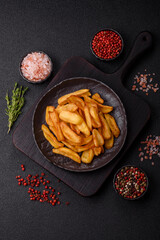 Fried crispy French fries with salt, spices, food for lunch