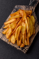 Fried crispy French fries with salt, spices, food for lunch