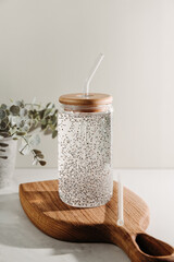 Chia water in a glass on a kitchen wooden board. Healthy detox drink.