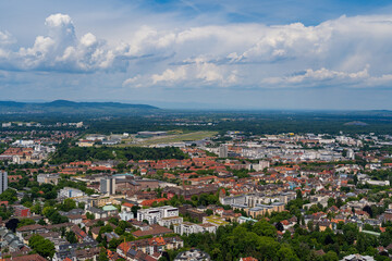 Expansive Freiburg Cityscape Under a Cloud-Dotted Sky