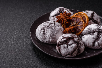 Chocolate crinkle cookies sprinkled with powdered sugar, homemade baking