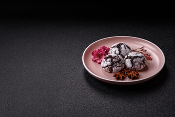 Chocolate crinkle cookies sprinkled with powdered sugar, homemade baking