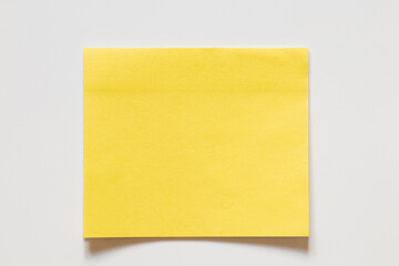 Yellow sticky note on white background for notes as background, reminders, announcements