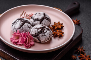 Chocolate crinkle cookies sprinkled with powdered sugar, homemade baking