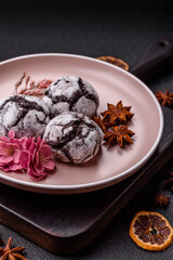 Chocolate crinkle cookies sprinkled with powdered sugar, homemade baking