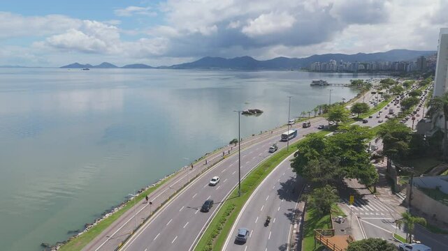 Aerial View of Coastal Avenue and Waterfront Buildings in a Coastal Metropolis