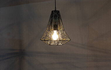 modern abstract geometric black chandelier on dark background