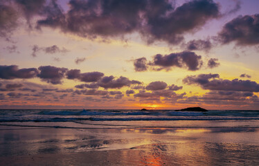 Portugal Atlantic sunset beach twilight dramatic clouds golden horizon ocean waves reflective sand serene evening seascape travel photography relaxing vacation nature scenic beauty inspiration