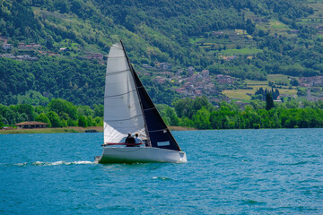 Sailboat cruising on Lake Iseo