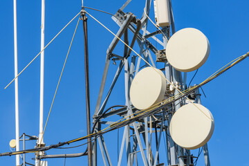 Telecommunication antennas and wireless communication antenna transmitter against the blue sky