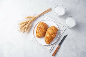 Sesame seeds braided bun on a white background
