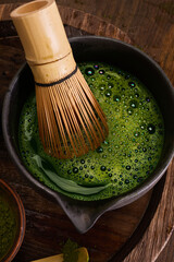 Matcha Whisking. Elegant matcha tea setup with whisk