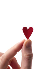 Obraz premium heart in hand, Fingers holding tiny red paper heart, minimalist