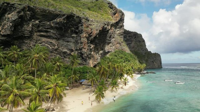Majestic flyby of Playa Front&oacute;n&rsquo;s high cliffs and vivid Caribbean sea, highlighting the intense natural beauty of this isolated beach