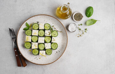 beautiful serving of cucumber and feta cheese salad. vegetarian cuisine. Healthy food. isolated on white background. top view